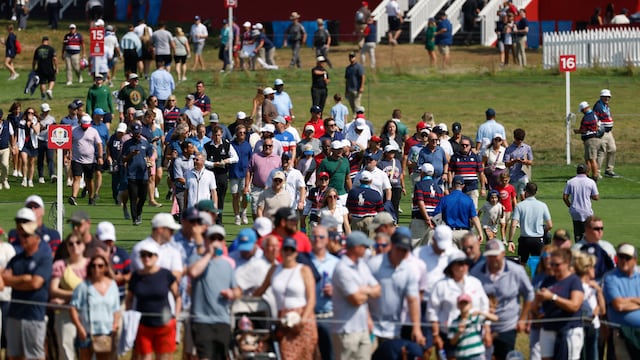 Golf - The 2025 Ryder Cup - Bethpage Black Golf Course, Farmingdale, New York, United States - September 23, 2025 Fans cross the fairway on the 16th hole during a practice round IMAGN IMAGES via Reuters/Peter Casey