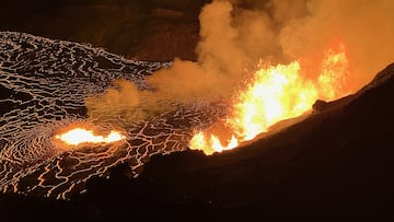 HAWAII, UNITED STATES - DECEMBER 23: (----EDITORIAL USE ONLY - MANDATORY CREDIT - 'N. DELIGNE / USGS / HANDOUT' - NO MARKETING NO ADVERTISING CAMPAIGNS - DISTRIBUTED AS A SERVICE TO CLIENTS----) USGS Hawaiian Volcano Observatory geologists are documented the new eruption within Kalupele that started this morning from the closed area of Hawaii Volcanoes National Park on December 23, 2024 in Hawaii, United States. HVO geologists collected samples of the new eruption that were being deposited on the caldera rim west of the caldera and they documented the lava fountains that were reaching up to 80 meters (260 feet). (Photo by N. Deligne/USGS/Anadolu via Getty Images)