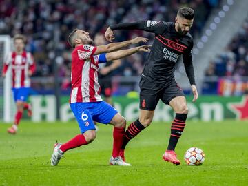 Koke y Olivier Giroud.