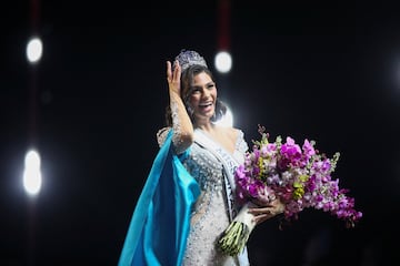 Sheynnis Palacios touches her crown after winning the Miss Universe pageant.