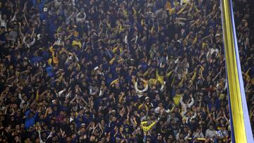 Supporters of Boca Juniors cheer for their team during their Argentine Professional Football League Tournament 2022 match against Arsenal at La Bombonera stadium in Buenos Aires, on June 5, 2022. (Photo by ALEJANDRO PAGNI / AFP)