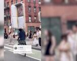 New York man goes viral after carrying a couch with his head while he rides a bike