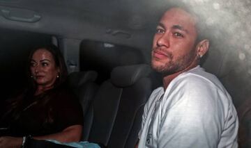 Brazilian superstar Neymar (R), is pictured next to his mother Nadine Goncalves Da Silva upon their arrival in Belo Horizonte, Minas Gerais state, Brazil