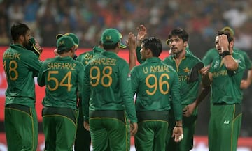 Mohammad Amir celebrates with teammates after Rohit Sharma's dismissal