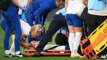 England's midfielder #04 Keira Walsh (C) is comforted by England's forward #09 Rachel Daly (L) as she is taken off on a stretcher after an injury during the Australia and New Zealand 2023 Women's World Cup Group D football match between England and Denmark at Sydney Football Stadium in Sydney on July 28, 2023. (Photo by FRANCK FIFE / AFP)