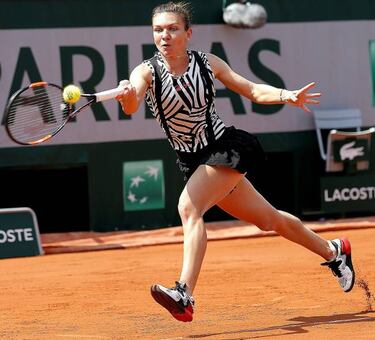 Spain's Muguruza beats Wickmayer to reach last 16