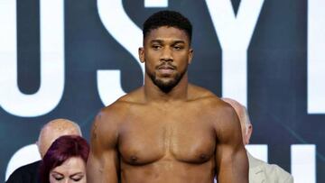 Britain's Anthony Joshua stands during a public weighing ahead of the heavyweight boxing rematch for the WBA, WBO, IBO and IBF titles between Joshua and Ukraine's Oleksandr Usyk, in the Saudi Red Sea city of Jeddah, on August 19, 2022. - The match, billed as Rage on the Red Sea, is set to take place on August 20, 2022, at the Jeddah Super Dome. (Photo by Giuseppe CACACE / AFP) (Photo by GIUSEPPE CACACE/AFP via Getty Images)