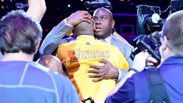 LOS ANGELES, CA - APRIL 13: Earvin &#039;Magic&#039; Johnson hugs Kobe Bryant #24 of the Los Angeles Lakers before the game against the Utah Jazz at Staples Center on April 13, 2016 in Los Angeles, California. NOTE TO USER: User expressly acknowledges and agrees that, by downloading and or using this photograph, User is consenting to the terms and conditions of the Getty Images License Agreement.   Harry How/Getty Images/AFP
 == FOR NEWSPAPERS, INTERNET, TELCOS &amp; TELEVISION USE ONLY ==