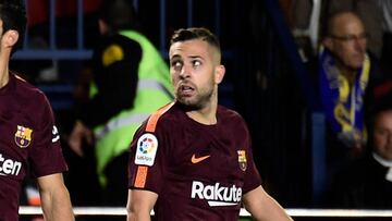 Barcelona's Uruguayan forward Luis Suarez (L) celebrates next to Barcelona's Spanish defender Jordi Alba after scoring during the Spanish league football match between Villarreal CF and FC Barcelona at La Ceramica stadium in Vila-real on December 10, 2017. / AFP PHOTO / JOSE JORDAN