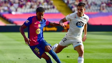 Barcelona's Spanish forward #19 Lamine Yamal fights for the ball with Real Valladolid's Brazilian defender #22 Lucas Rosa during the Spanish league football match between FC Barcelona and Real Valladolid FC at the Estadi Olimpic Lluis Companys in Barcelona on August 31, 2024. (Photo by MANU QUINTERO / AFP)