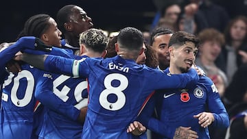 Chelsea players including Chelsea's Portuguese midfielder #07 Pedro Neto (R) celebrate their second goal scored by Chelsea's Brazilian striker #20 Joao Pedro (obscured) during the English Premier League football match between Chelsea and Wolverhampton Wanderers at Stamford Bridge in London on November 8, 2025. (Photo by HENRY NICHOLLS / AFP) / RESTRICTED TO EDITORIAL USE. No use with unauthorized audio, video, data, fixture lists, club/league logos or 'live' services. Online in-match use limited to 120 images. An additional 40 images may be used in extra time. No video emulation. Social media in-match use limited to 120 images. An additional 40 images may be used in extra time. No use in betting publications, games or single club/league/player publications. /
