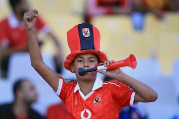 Al-Ahly supporters cheer for their team during the CAF Champions League final football match between Al-Ahly vs Wydad Casablanca at the Borg El Arab Stadium in Alexandria on October 28, 2017.