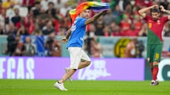 LUSAIL CITY, QATAR - NOVEMBER 28: A protester on the pitch with rainbow flag during the FIFA World Cup Qatar 2022 Group H match between Portugal and Uruguay at Lusail Stadium on November 28, 2022 in Lusail City, Qatar. (Photo by Manuel Reino Berengui/DeFodi Images via Getty Images)