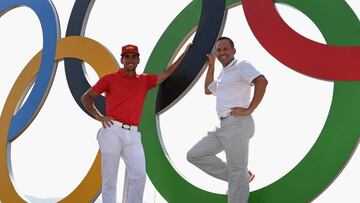 RIO DE JANEIRO, BRAZIL - AUGUST 09: Sergio Garcia of Spain and Rafa Cabrera-Bello of Spain pose with the Olympic rings during a practice round at Olympic Golf Course on August 9, 2016 in Rio de Janeiro, Brazil. (Photo by Ross Kinnaird/Getty Images)