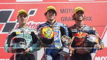 MOTEGI, JAPAN - OCTOBER 21: (L-R) Lorenzo Dalla Porta of Italy and Leopard Racing, Marco Bezzecchi of Italy and Pruestel GP and Darryn Binder of South Africa and Red Bull Team Ajo celebrate on the podium during the Moto3 race during the MotoGP of Japan - Race at Twin Ring Motegi on October 21, 2018 in Motegi, Japan. (Photo by Mirco Lazzari gp/Getty Images)