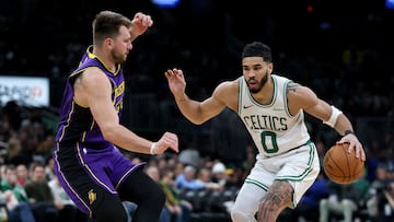 BOSTON, MASSACHUSETTS - MARCH 08: Jayson Tatum #0 of the Boston Celtics looks for the open lane as Luka Doncic #77 of the Los Angeles Lakers defends during the second half at TD Garden on March 08, 2025 in Boston, Massachusetts. The Boston Celtics defeated the Los Angeles Lakers 111-101. NOTE TO USER: User expressly acknowledges and agrees that, by downloading and or using this photograph, User is consenting to the terms and conditions of the Getty Images License Agreement. Elsa/Getty Images/AFP (Photo by ELSA / GETTY IMAGES NORTH AMERICA / Getty Images via AFP)