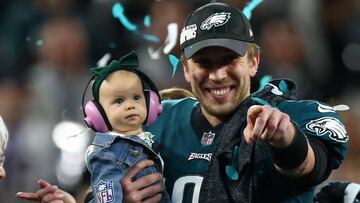 Feb 4, 2018; Minneapolis, MN, USA; Philadelphia Eagles quarterback Nick Foles (9) celebrates with daughter Lily after defeating the New England Patriots in Super Bowl LII at U.S. Bank Stadium. Mandatory Credit: Mark J. Rebilas-USA TODAY Sports