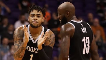 PHOENIX, AZ - NOVEMBER 06: D'Angelo Russell #1 of the Brooklyn Nets reacts alongside Quincy Acy #13 during the second half of the NBA game against the Phoenix Suns at Talking Stick Resort Arena on November 6, 2017 in Phoenix, Arizona. The Nets defeated the Suns 98-92. NOTE TO USER: User expressly acknowledges and agrees that, by downloading and or using this photograph, User is consenting to the terms and conditions of the Getty Images License Agreement. Christian Petersen/Getty Images/AFP
== FOR NEWSPAPERS, INTERNET, TELCOS & TELEVISION USE ONLY ==