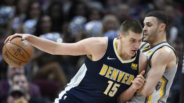 Mar 3, 2018; Cleveland, OH, USA; Cleveland Cavaliers forward Larry Nance Jr. (22) defends Denver Nuggets center Nikola Jokic (15) in the third quarter at Quicken Loans Arena. Mandatory Credit: David Richard-USA TODAY Sports