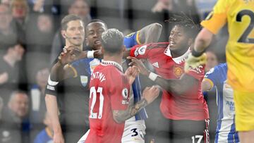 Brighton's Ecuadrorian defender Pervis Estupinan (L) clashes with Manchester United's Brazilian midfielder Antony (C) during the English Premier League football match between Brighton and Hove Albion and Manchester United at the American Express Community Stadium in Brighton, southern England on May 4, 2023. (Photo by Glyn KIRK / AFP) / RESTRICTED TO EDITORIAL USE. No use with unauthorized audio, video, data, fixture lists, club/league logos or 'live' services. Online in-match use limited to 120 images. An additional 40 images may be used in extra time. No video emulation. Social media in-match use limited to 120 images. An additional 40 images may be used in extra time. No use in betting publications, games or single club/league/player publications. / 