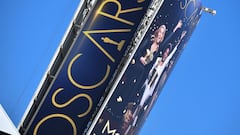 A sign announcing the upcoming Oscars Award show towers over Hollywood Boulevard, March 18, 2022, in Hollywood, California. - The 94th Academy Awards will take place on March 27, 2022 at the Dolby Theatre. (Photo by Robyn Beck / AFP)