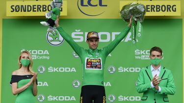 Cycling - Tour de France - Stage 3 - Vejle to Sonderborg - Denmark - July 3, 2022 Jumbo - Visma's Wout Van Aert celebrates on the podium wearing the green jersey after stage 3 REUTERS/Annegret Hilse