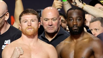 LAS VEGAS, NEVADA - SEPTEMBER 12: Canelo Alvarez (L) and Terence Crawford pose during a ceremonial weigh-in at T-Mobile Arena on September 12, 2025 in Las Vegas, Nevada. UFC president Dana White (C) looks on.Alvarez and Crawford are scheduled to fight on�September 13, 2025, at Allegiant Stadium in Las Vegas. Steve Marcus/Getty Images/AFP (Photo by Steve Marcus / GETTY IMAGES NORTH AMERICA / Getty Images via AFP)