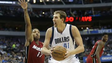 Dallas Mavericks forward Dirk Nowitzki (41) of Germany holds the ball as Miami Heat guard Rodney McGruder (17) closes in to defend during the second half of an NBA basketball game in Dallas, Monday, Feb. 27, 2017. The Mavericks won 96-89. (AP Photo/LM Otero)