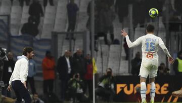 Marseille's head coach Andre Villas-Boas reacts as Marseille's Duje Caleta-Car clears the ball during the French League One soccer match between Marseille and Angers at the Stade Velodrome in Marseille, France, Saturday, Jan. 25, 2020. (AP Photo