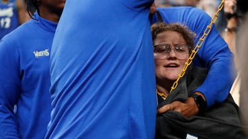 Apr 16, 2022; Memphis, Tennessee, USA; A protester chains herself to a basket during the first half of game one of the first round for the 2022 NBA playoffs at FedExForum. Mandatory Credit: Christine Tannous-USA TODAY Sports