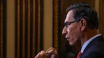 Handout picture released by the Peruvian presidency of President MartxEDn Vizcarra speaking during a televised announcement to the Nation on July 5, 2020, in Lima, to announce he will call for a referendum in 2021 to decide on the elimination of parliamentary immunity. - The president announced that due to the coronavirus pandemic, the popular consultation will be held taking advantage of the general elections of 2021, where Peruvians will elect the new president, congressmen and Andean parliamentarians. (Photo by AndrxE9s Valle / Peruvian Presidency / AFP) / RESTRICTED TO EDITORIAL USE - MANDATORY CREDIT 'AFP PHOTO / PRESIDENCIA DEL PERU - ANDRES VALLE' - NO MARKETING - NO ADVERTISING CAMPAIGNS - DISTRIBUTED AS A SERVICE TO CLIENTS