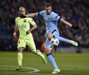 Edin Dzeko y Javier Mascherano.