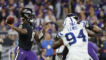 Oct 11, 2021; Baltimore, Maryland, USA; Baltimore Ravens quarterback Lamar Jackson (8) passes the ball as Indianapolis Colts defensive end Tyquan Lewis (94) defends during the third quarter at M&amp;T Bank Stadium. Mandatory Credit: Geoff Burke-USA TODAY 