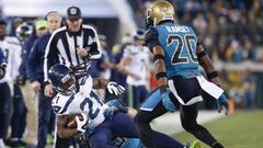 Dec 10, 2017; Jacksonville, FL, USA; Seattle Seahawks cornerback DeAndre Elliott (21) is taken down by Jacksonville Jaguars middle linebacker Paul Posluszny (51) as cornerback Jalen Ramsey (20) looks on during the second quarter  at EverBank Field. Mandatory Credit: Reinhold Matay-USA TODAY Sports