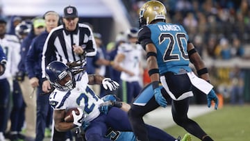 Dec 10, 2017; Jacksonville, FL, USA; Seattle Seahawks cornerback DeAndre Elliott (21) is taken down by Jacksonville Jaguars middle linebacker Paul Posluszny (51) as cornerback Jalen Ramsey (20) looks on during the second quarter at EverBank Field. Mandatory Credit: Reinhold Matay-USA TODAY Sports
