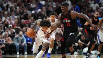 Apr 4, 2024; Miami, Florida, USA;  Philadelphia 76ers guard Kelly Oubre Jr. (9) picks up a loose ball and drives past Miami Heat forward Jimmy Butler (22) during the second half at Kaseya Center. Mandatory Credit: Jim Rassol-USA TODAY Sports