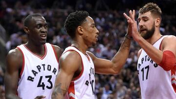 Oct 26, 2016; Toronto, Ontario, CAN; Toronto Raptors guard DeMar DeRozan (10) is greeted by center Jonas Valanciunas (17) and forward Pascal Siakam (43) after making a basket against Detroit Pistons in the second half at Air Canada Centre. Mandatory Credit: Dan Hamilton-USA TODAY Sports