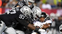 CANTON, OHIO - AUGUST 04: Snoop Conner #24 of the Jacksonville Jaguars is tackled by Kendal Vickers #95, Andrew Billings #97 and Tashawn Bower #96 of the Las Vegas Raiders during the first half of the 2022 Pro Hall of Fame Game at Tom Benson Hall Of Fame Stadium on August 04, 2022 in Canton, Ohio.   Nick Cammett/Getty Images/AFP
== FOR NEWSPAPERS, INTERNET, TELCOS & TELEVISION USE ONLY ==