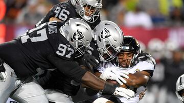 CANTON, OHIO - AUGUST 04: Snoop Conner #24 of the Jacksonville Jaguars is tackled by Kendal Vickers #95, Andrew Billings #97 and Tashawn Bower #96 of the Las Vegas Raiders during the first half of the 2022 Pro Hall of Fame Game at Tom Benson Hall Of Fame Stadium on August 04, 2022 in Canton, Ohio.   Nick Cammett/Getty Images/AFP
== FOR NEWSPAPERS, INTERNET, TELCOS & TELEVISION USE ONLY ==