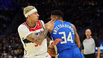 Giannis Antetokounmpo #34 of the Milwaukee Bucks drives around Kyle Kuzma #33 of the Washington Wizards