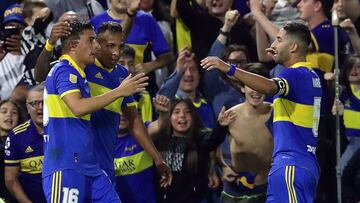 Boca Juniors' Uruguayan forward Miguel Merentiel (L) celebrates with teammates midfielder Alan Varela (R) and Colombian forward Sebastian Villa after scoring the team's third goal against Racing Club during the Argentine Professional Football League Tournament match at La Bombonera stadium in Buenos Aires, on April 29, 2023. (Photo by ALEJANDRO PAGNI / AFP)