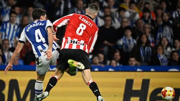 Real Sociedad's Spanish midfielder #04 Jon Gorrotxategi (L) and Athletic Bilbao's Spanish midfielder #08 Oihan Sancet get tangled as they vie for the ball during the Copa del Rey (King's Cup) semi final second leg football match between Real Sociedad and Athletic Club Bilbao at thep Anoeta Stadium in San Sebastian on March 4, 2026. (Photo by ANDER GILLENEA / AFP)