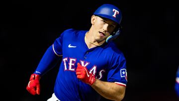 SURPRISE, ARIZONA - MARCH 14: Wyatt Langford #82 of the Texas Rangers rounds the bases after hitting a grand slam during the Spring Training Game against the Cincinnati Reds at Surprise Stadium on March 14, 2024 in Surprise, Arizona.   John E. Moore III/Getty Images/AFP (Photo by John E. Moore III / GETTY IMAGES NORTH AMERICA / Getty Images via AFP)