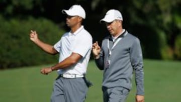 Tiger Woods, junto a Chris Como, su nuevo gurú.