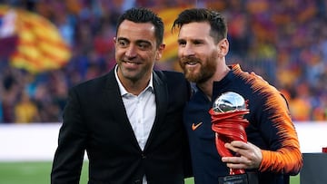 Xavi, con Messi en una imagen de 2022.