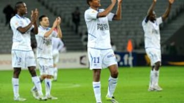 Los jugadores del Auxerre celebran haber eliminado al Lille.