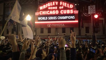 CHICAGO, IL - NOVEMBER 02: Chicago Cubs fans celebrate outside Wrigley Field after the Cubs defeated the Cleveland Indians in game seven of the 2016 World Series on November 2, 2016 in Chicago, Illinois. The Cubs 8-7 victory landed them their first World Series title since 1908.   Scott Olson/Getty Images/AFP
 == FOR NEWSPAPERS, INTERNET, TELCOS &amp; TELEVISION USE ONLY ==