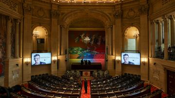 Screens display an image of Senator Miguel Uribe Turbay, who was shot in the head at a campaign event on June 7, ahead of the arrival of his coffin at Colombia's Congress, where a tribute will be held, in Bogota, Colombia, August 11, 2025. REUTERS/Luisa Gonzalez