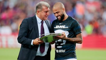 BARCELONA, SPAIN - AUGUST 7: Dani Alves of Pumas Unam honored for 431 matches played for FC Barcelona by president Joan Laporta during the Club Friendly   match between FC Barcelona v Pumas at the Spotify Camp Nou on August 7, 2022 in Barcelona Spain (Photo by David S. Bustamante/Soccrates/Getty Images)
