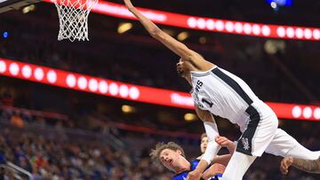 Victor Wembanyama #1 of the San Antonio Spurs drives on Moritz Wagner #21 of the Orlando Magic during a game at Kia Center on February 08, 2024 in Orlando, Florida.